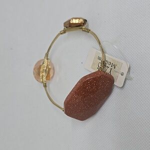 Gold wire bracelet with copper stones